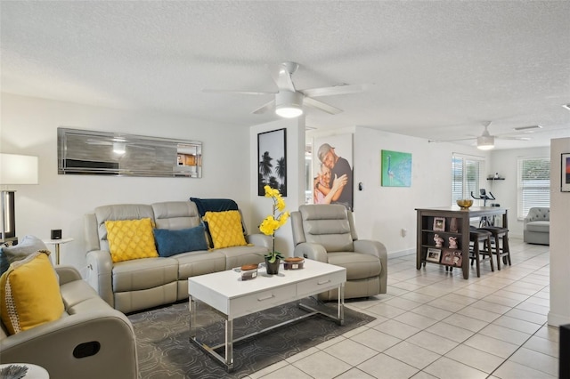 7740 Bracken Dr, Port Richey, FL 34668 - living room featuring ceiling fan, a textured ceiling, and light tile patterned floors