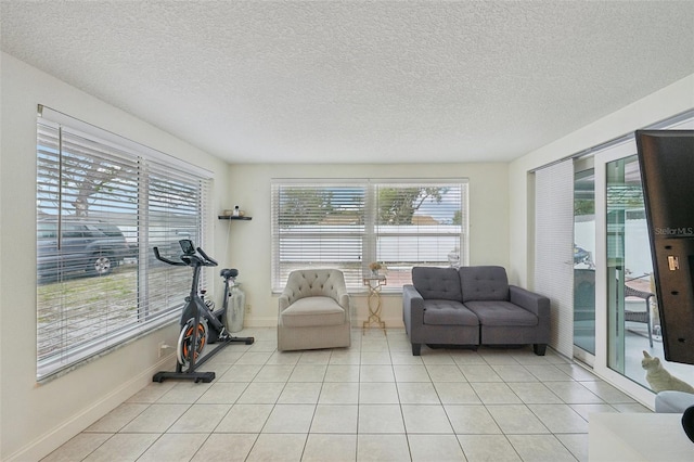 7740 Bracken Dr, Port Richey, FL 34668 - interior space featuring plenty of natural light, light tile patterned flooring, and baseboards