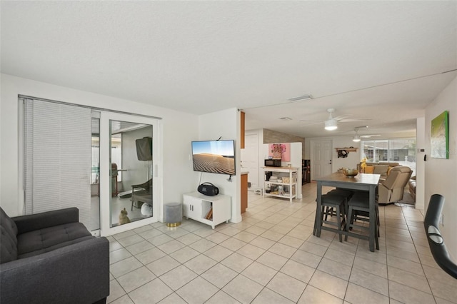 7740 Bracken Dr, Port Richey, FL 34668 - living area with ceiling fan, light tile patterned flooring, and visible vents