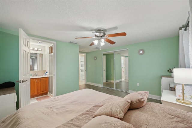 7740 Bracken Dr, Port Richey, FL 34668 - bedroom featuring a textured ceiling, a sink, visible vents, light wood-style floors, and a closet