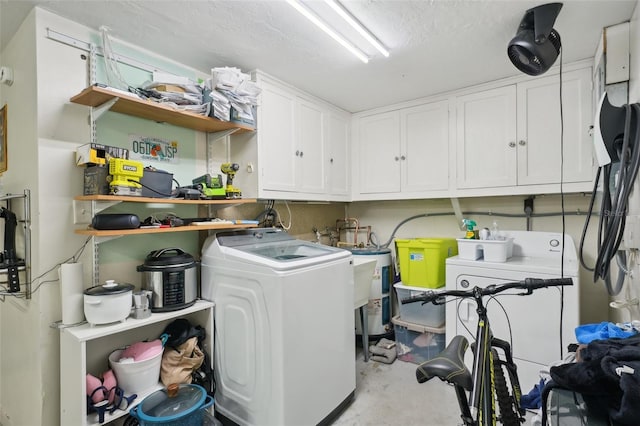 7740 Bracken Dr, Port Richey, FL 34668 - laundry room featuring a sink, cabinet space, separate washer and dryer, and a textured ceiling