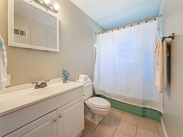 full bathroom with tile patterned flooring, toilet, visible vents, vanity, and shower / bath combo