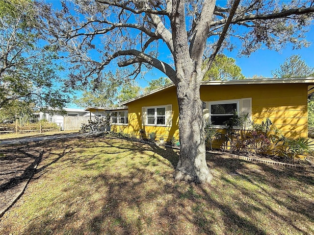 rear view of house with a yard