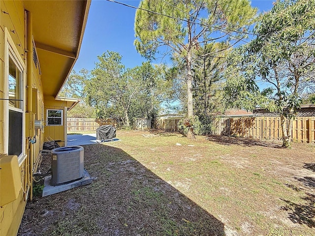 view of yard featuring a fenced backyard and cooling unit