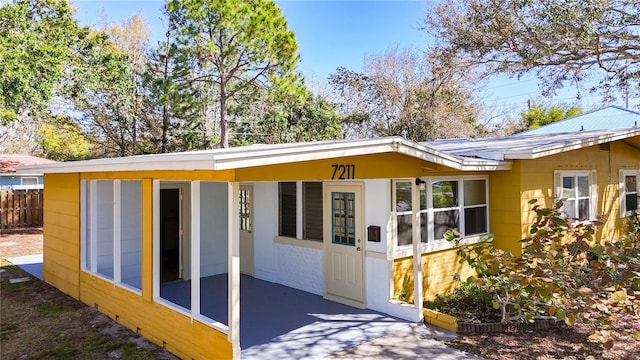 view of front of home featuring fence