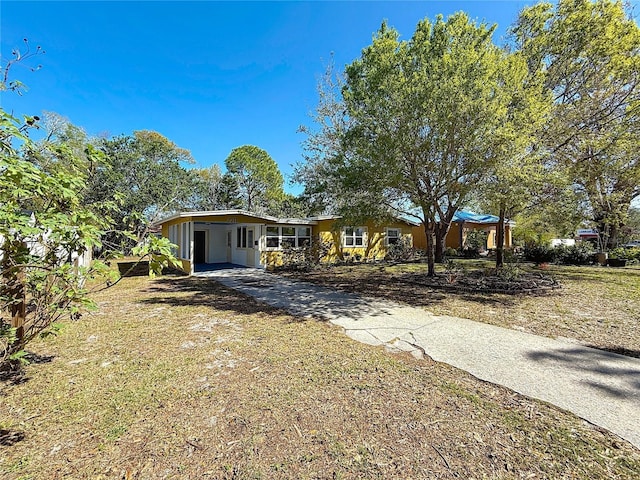 view of front of house with concrete driveway