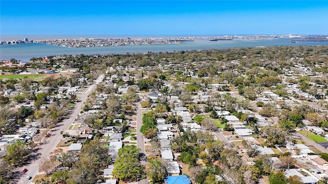 drone / aerial view with a residential view and a water view