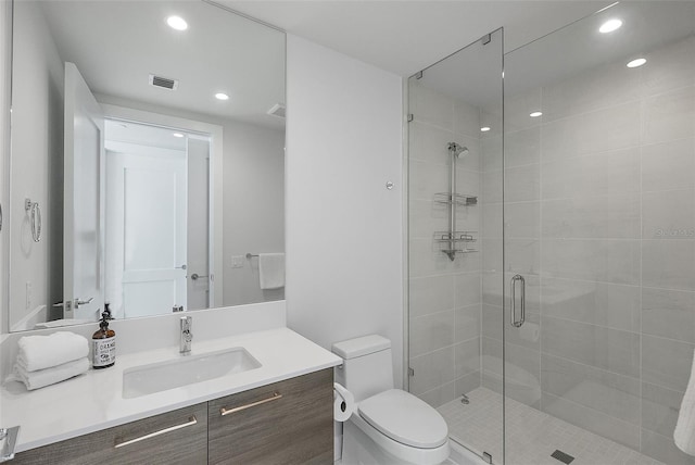 full bath featuring visible vents, toilet, vanity, a shower stall, and recessed lighting