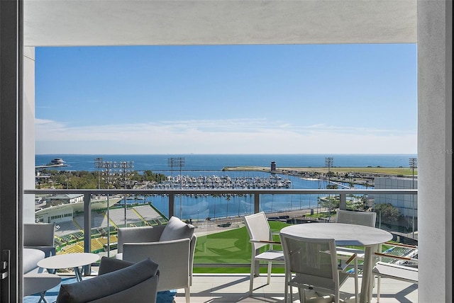 balcony featuring a water view