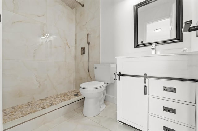 full bathroom with vanity, toilet, baseboards, and a marble finish shower