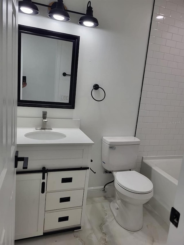 bathroom with baseboards, toilet, marble finish floor, and vanity