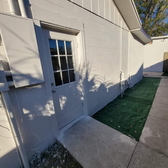 view of property exterior featuring concrete block siding