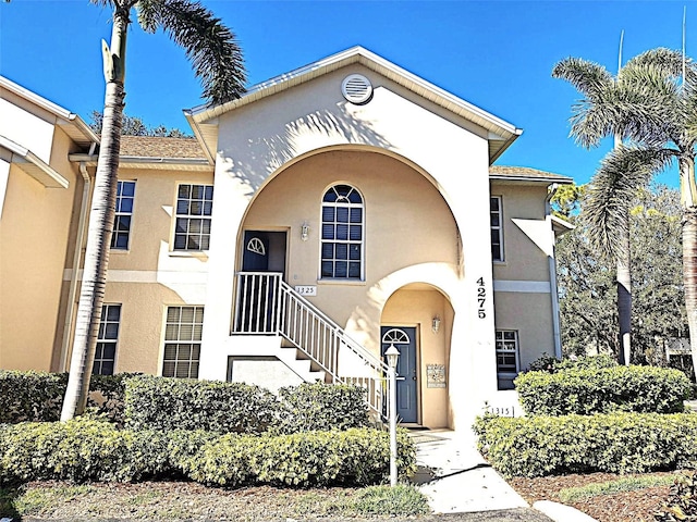 mediterranean / spanish-style home with stucco siding