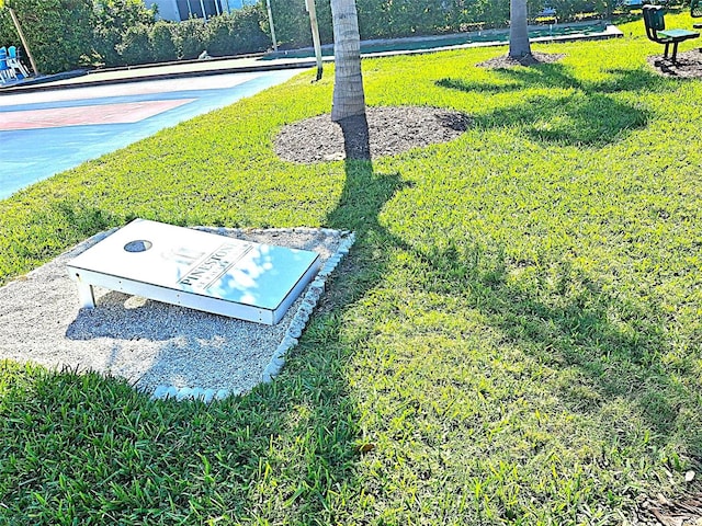 view of storm shelter with a lawn