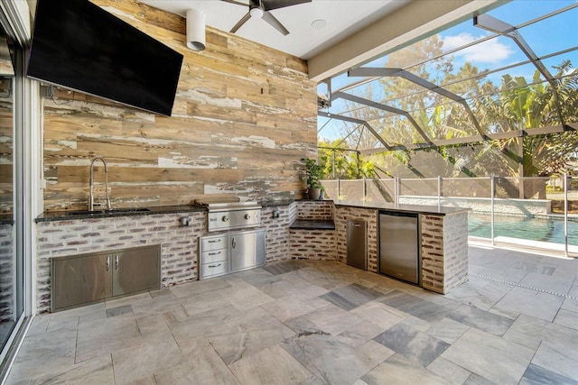 view of patio with area for grilling, a grill, a lanai, and ceiling fan