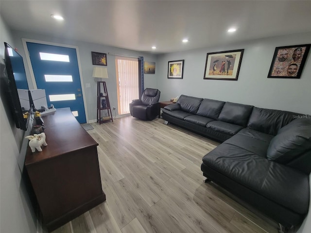 living room with wood finished floors and recessed lighting