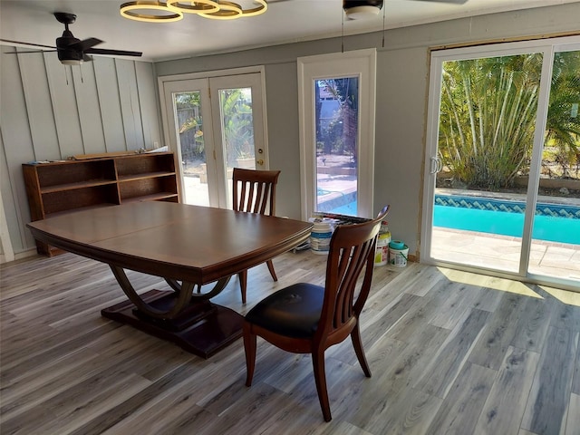 dining area with ceiling fan and wood finished floors