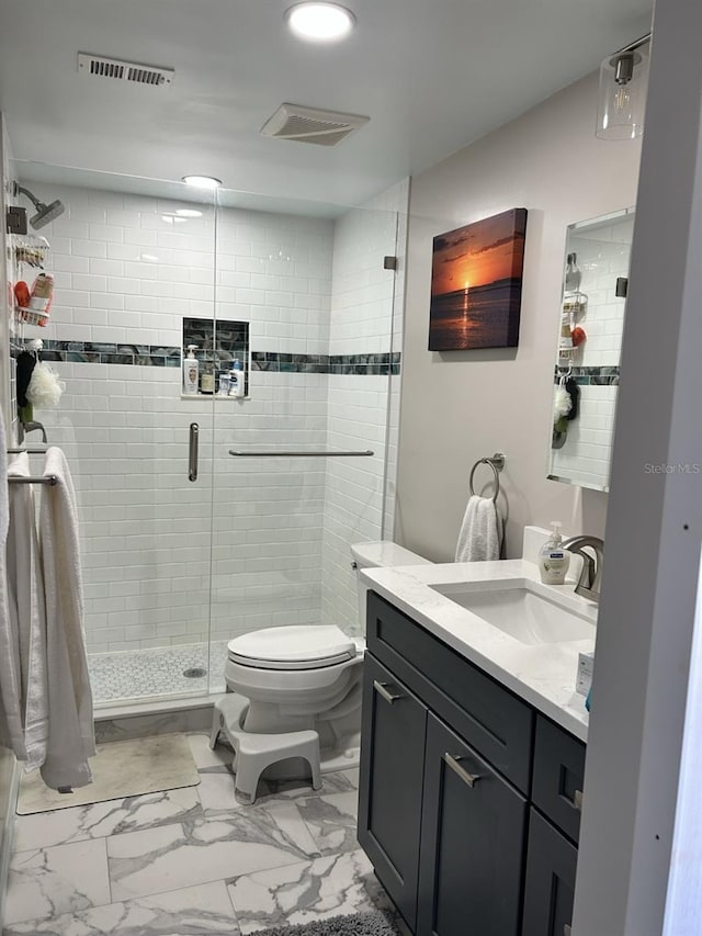 full bath featuring marble finish floor, visible vents, toilet, a shower stall, and vanity