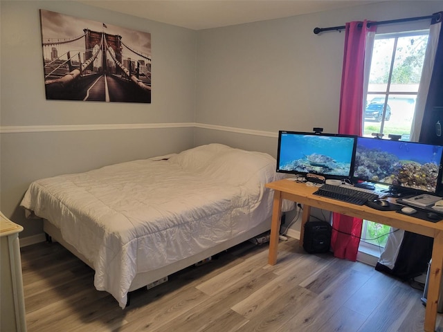 bedroom featuring wood finished floors