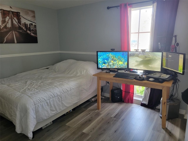 bedroom featuring wood finished floors