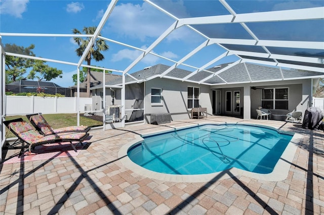 view of pool featuring a fenced in pool, fence, a lanai, and a patio area