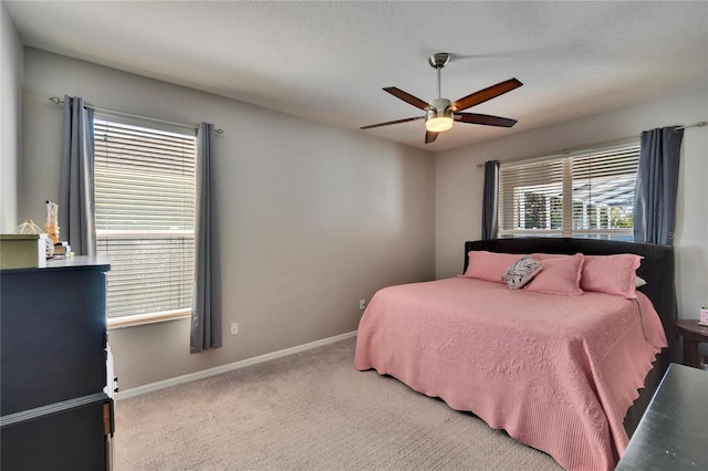 bedroom featuring baseboards, carpet floors, and ceiling fan