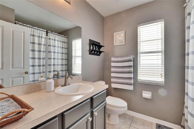 bathroom featuring vanity, baseboards, tile patterned flooring, curtained shower, and toilet