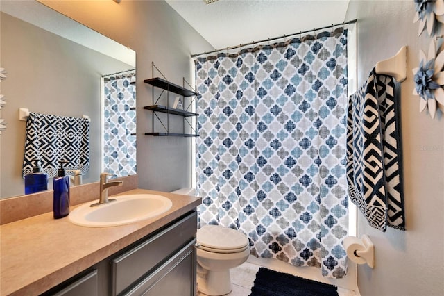 full bathroom featuring vanity, tile patterned floors, toilet, and a shower with curtain