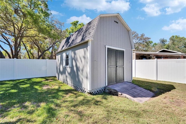 view of shed with a fenced backyard