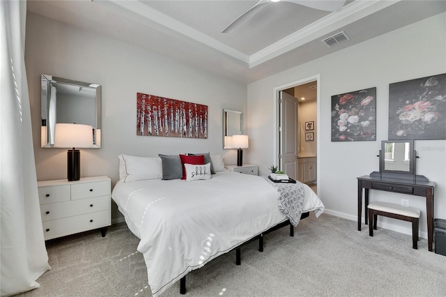 bedroom featuring ensuite bathroom, carpet floors, visible vents, and baseboards