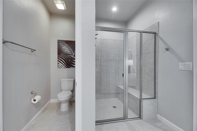 full bath with a stall shower, baseboards, toilet, and tile patterned floors