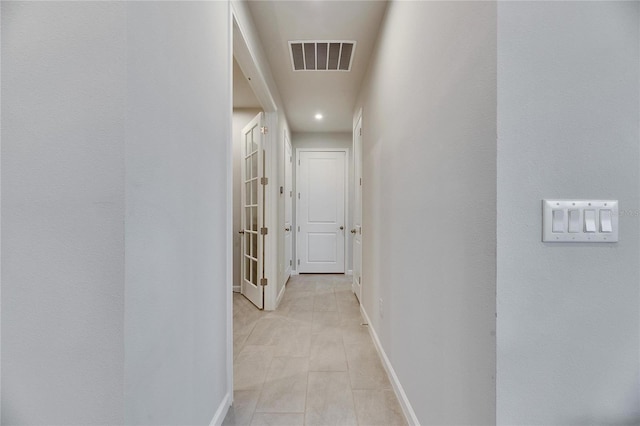 corridor with visible vents and baseboards