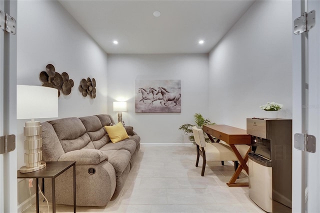 living area with recessed lighting and baseboards