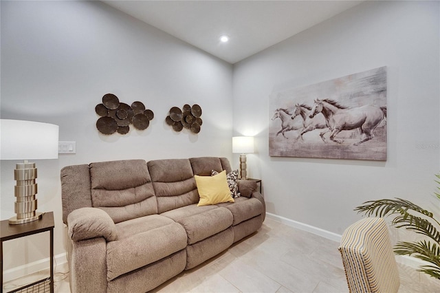 living room with recessed lighting and baseboards