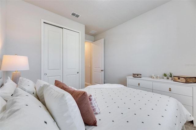 bedroom featuring visible vents and a closet