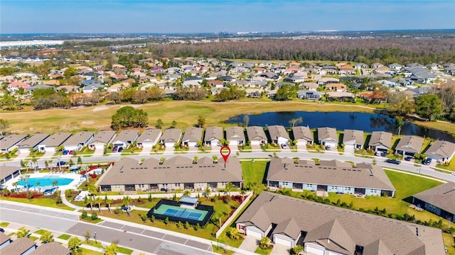 birds eye view of property featuring a water view and a residential view