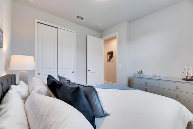 bedroom featuring a closet and visible vents