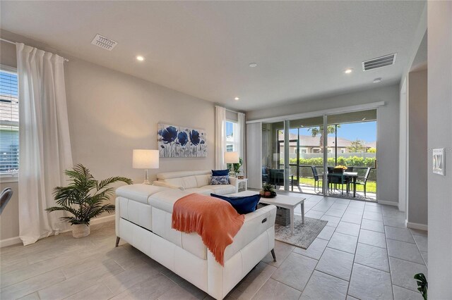 3753 Maxwell Park Dr, Sun City Center, FL 33573 - living room featuring baseboards and recessed lighting
