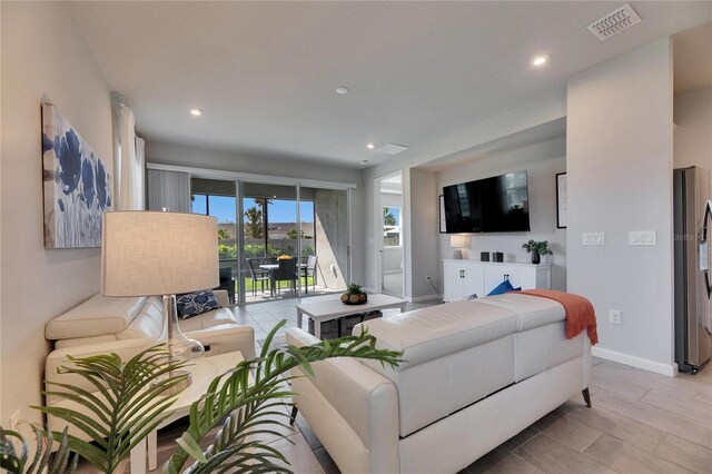 3753 Maxwell Park Dr, Sun City Center, FL 33573 - living area with recessed lighting and baseboards