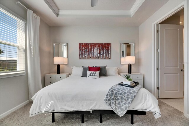 3753 Maxwell Park Dr, Sun City Center, FL 33573 - carpeted bedroom with crown molding, a tray ceiling, and baseboards