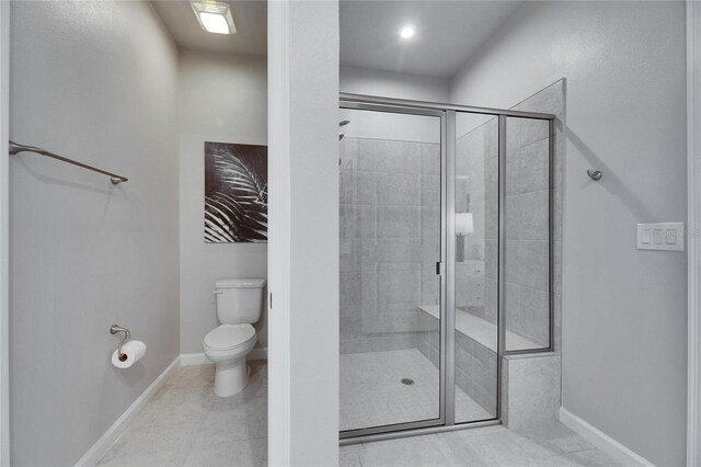 3753 Maxwell Park Dr, Sun City Center, FL 33573 - full bath featuring toilet, a stall shower, baseboards, and tile patterned flooring