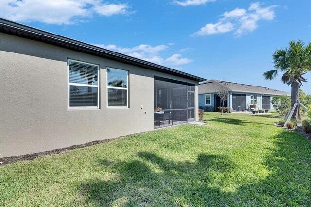 3753 Maxwell Park Dr, Sun City Center, FL 33573 - view of grassy yard featuring a sunroom