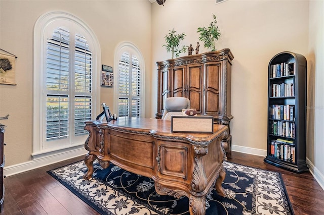 5914 Fitzgerald Rd, Odessa, FL 33556 - office area with baseboards and dark wood-style flooring