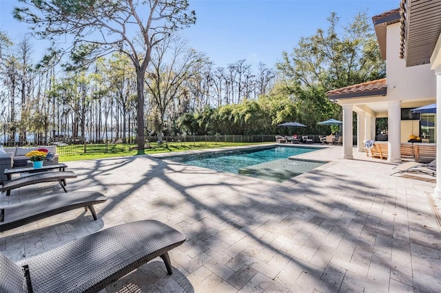 5914 Fitzgerald Rd, Odessa, FL 33556 - view of swimming pool featuring a patio, fence, and view of wooded area