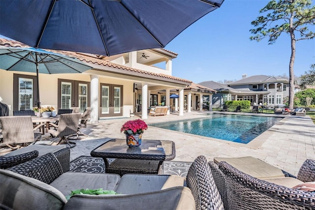 5914 Fitzgerald Rd, Odessa, FL 33556 - swimming pool with french doors, an outdoor living space, a patio, and outdoor dining area