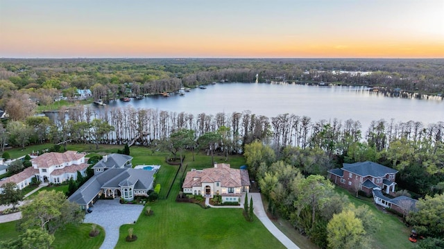 5914 Fitzgerald Rd, Odessa, FL 33556 - aerial view at dusk of a water view, a forest view, and a residential view