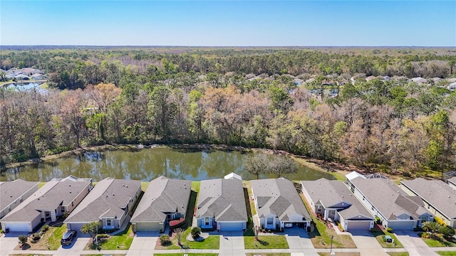 aerial view with a water view, a residential view, and a view of trees