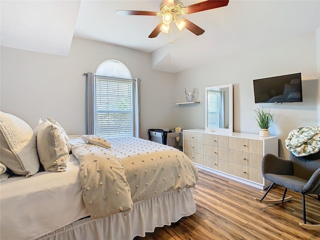 bedroom with a ceiling fan and wood finished floors