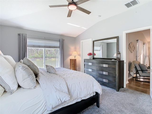 bedroom with a ceiling fan, visible vents, and vaulted ceiling