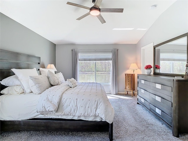 bedroom with carpet floors, lofted ceiling, and a ceiling fan